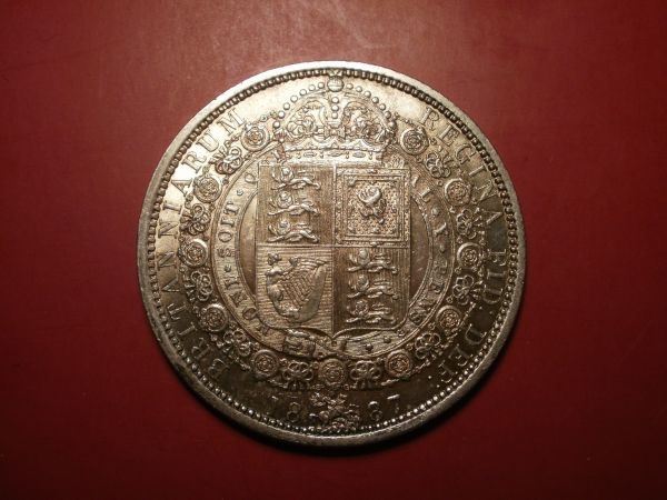 Die-Error-By-Earring-On-Obverse-Of-1887-Half-Crown?